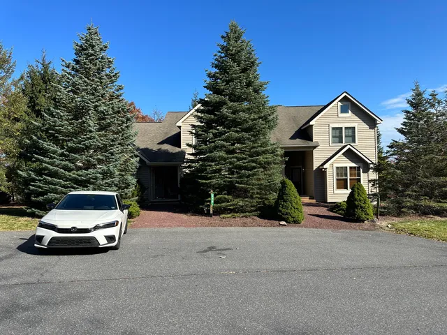 a car parked in front of a house