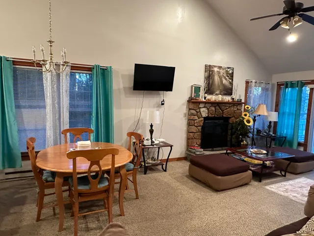 a outdoor living space with furniture and a flat screen tv