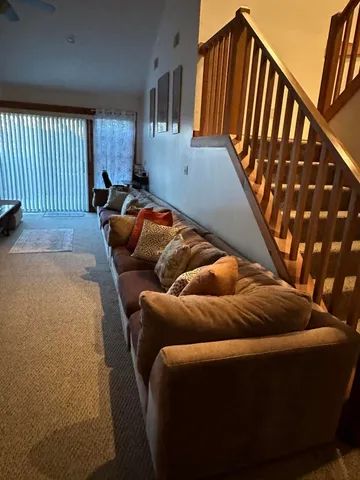 a blue bed sitting in a bedroom next to a window