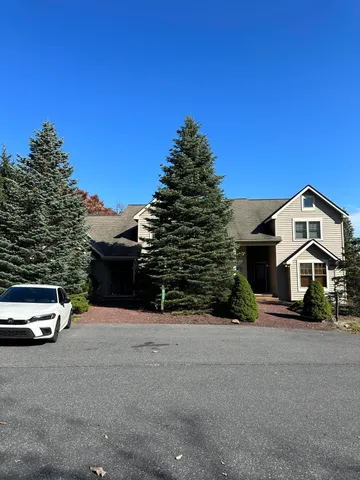 a car parked in front of a house