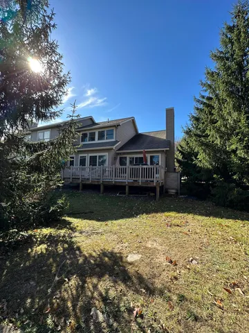 a view of a house with swimming pool