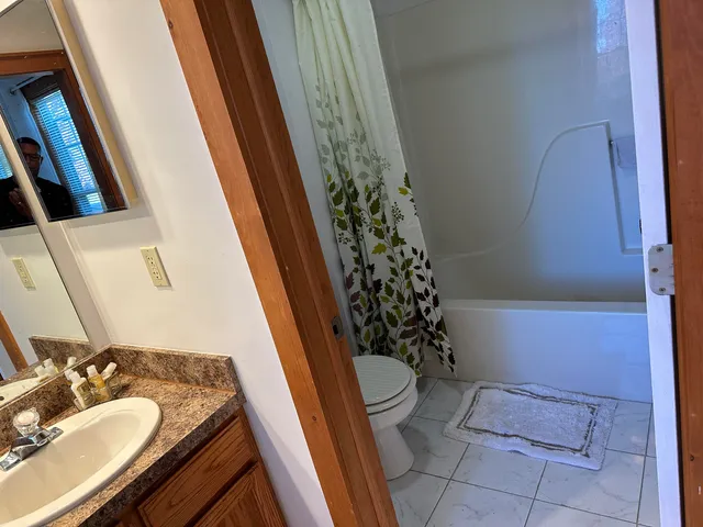 a bathroom with a sink and toilet
