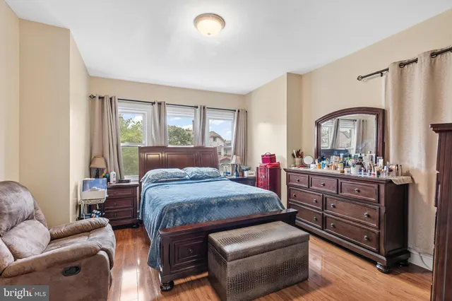 a bed room with furniture and a window