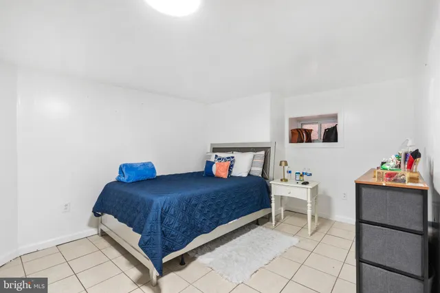 a bedroom with a bed and cabinets