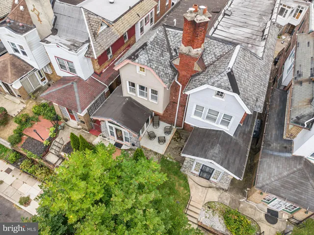 an aerial view of residential house with outdoor space and parking