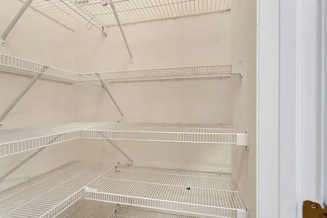 a view of a room with racks on the wall