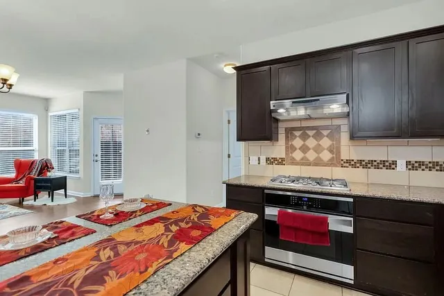 a bedroom with a bed and wooden cabinets