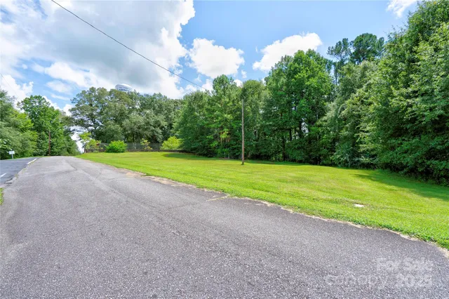 a view of a field with an trees