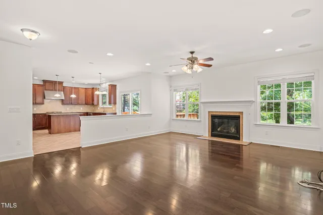 a view of a kitchen with an empty space and a fireplace