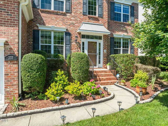 front view of a house with a garden