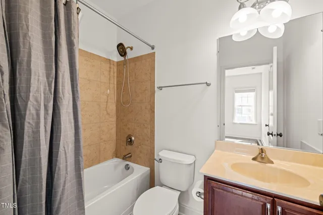 a bathroom with a sink toilet tub and shower