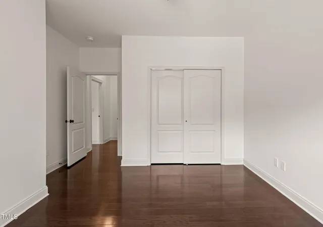 an empty room with wooden floor