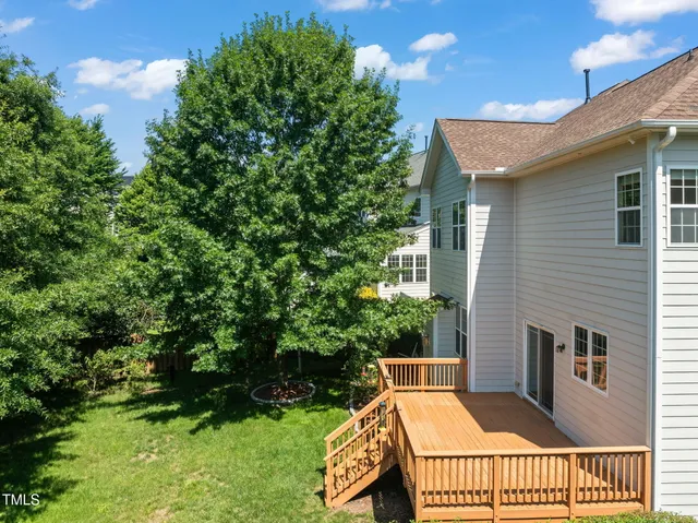 a view of a house with backyard porch and sitting area