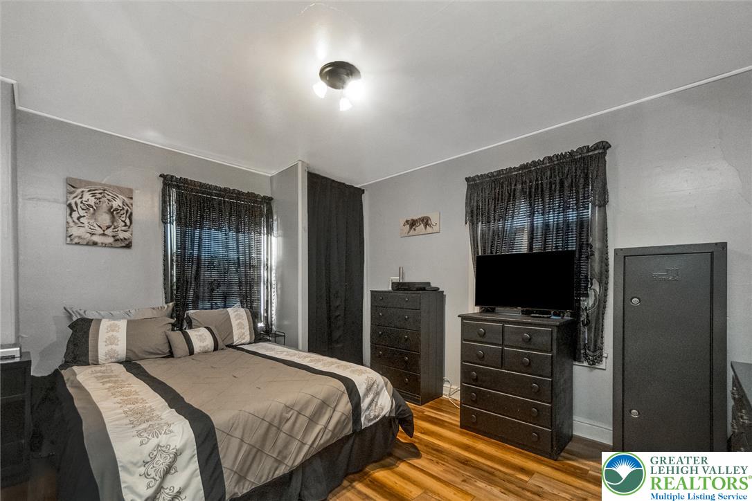 365 Rock Street Easton, PA 18042 - Photo 23 of 50 Hardwood floors and a subtle ceiling light illuminate this comfortable, private sleeping space.