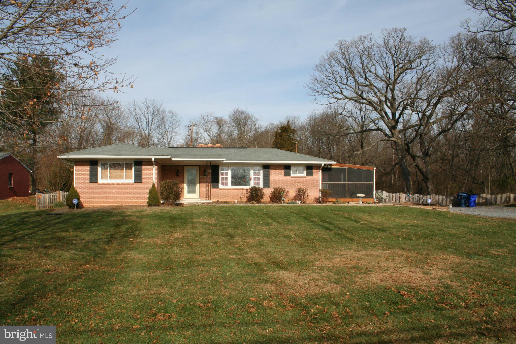 2140 Ballenger Creek Pike Point of Rocks, MD 21777 - Photo 1 of 23 a front view of a house with a garden