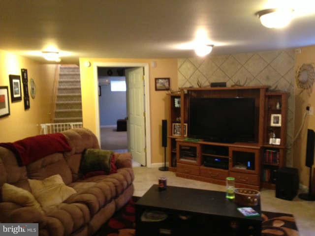 2140 Ballenger Creek Pike Point of Rocks, MD 21777 - Photo 12 of 23 a living room with furniture and a flat screen tv