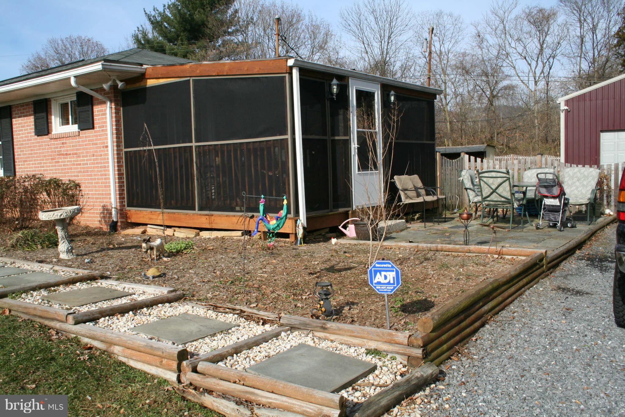 2140 Ballenger Creek Pike Point of Rocks, MD 21777 - Photo 21 of 23 a view of a backyard with chairs and a patio