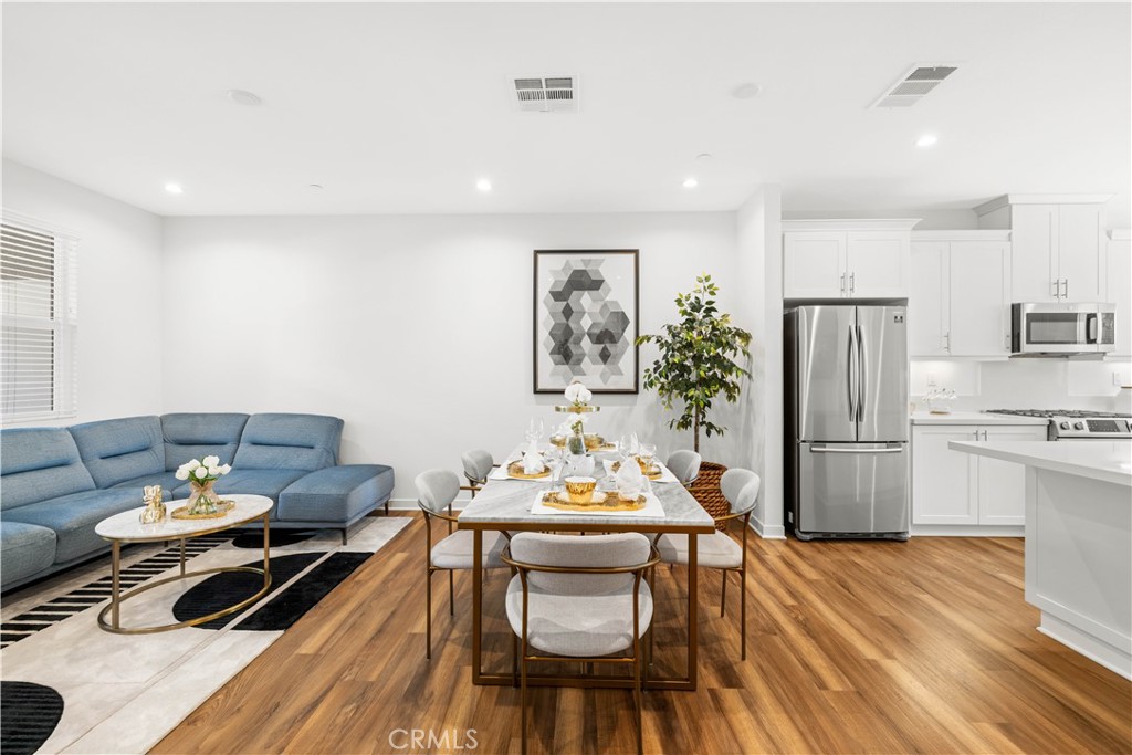2256 Synergy Irvine, CA 92614 - Photo 1 of 1 a living room with furniture and kitchen view