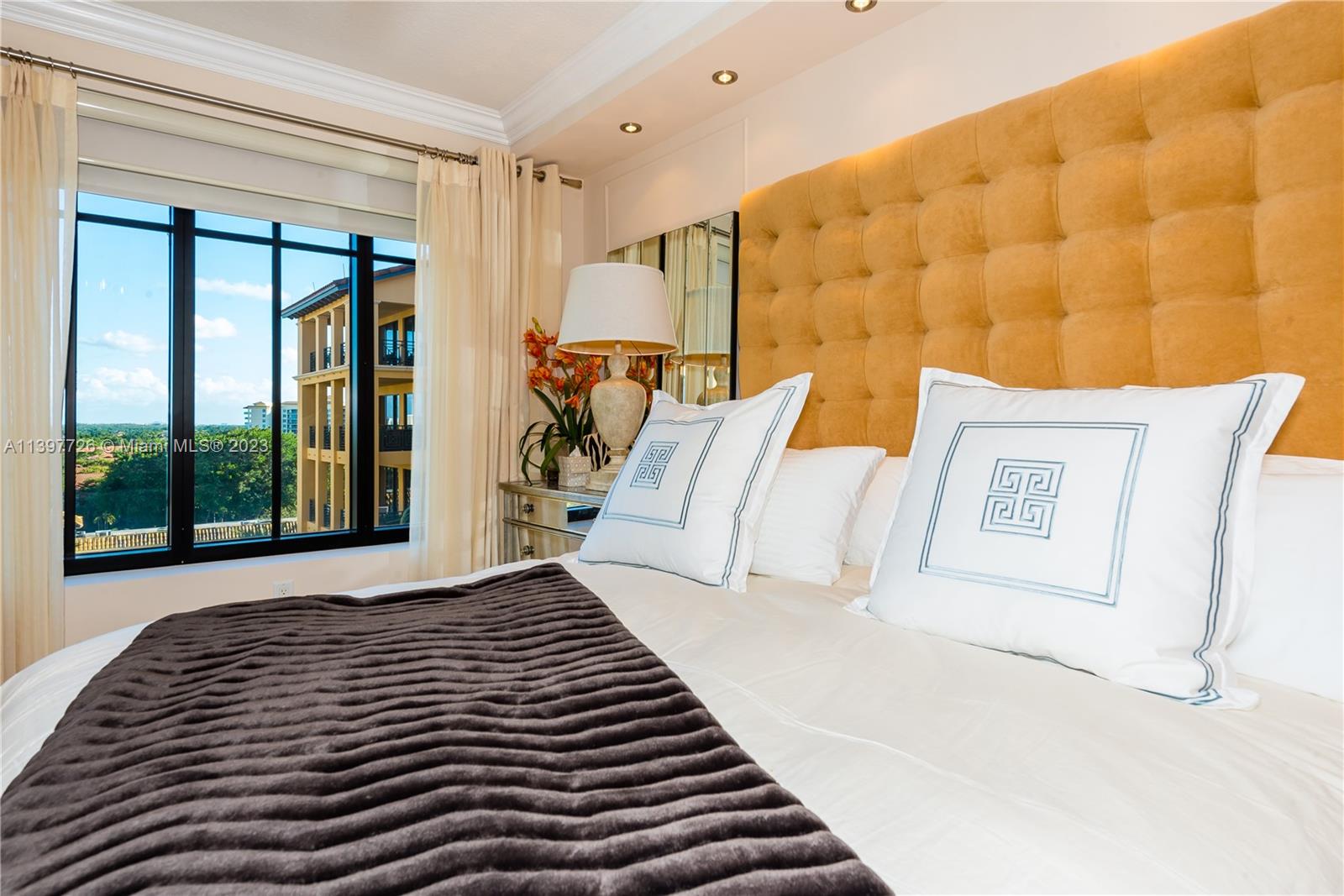 200 East Palmetto Park Road, Unit 700 Boca Raton, FL 33432 - Photo 12 of 31 a bed room with a bed and a large window