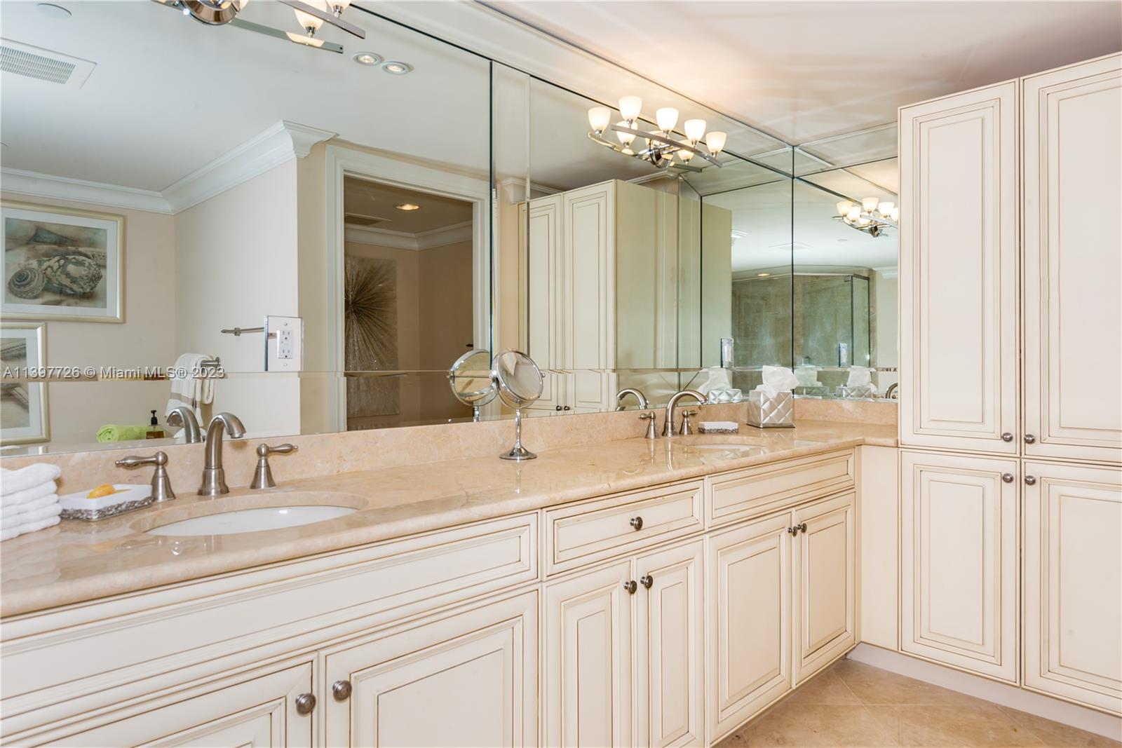 200 East Palmetto Park Road, Unit 700 Boca Raton, FL 33432 - Photo 15 of 31 a bathroom with a sink double vanity and a mirror