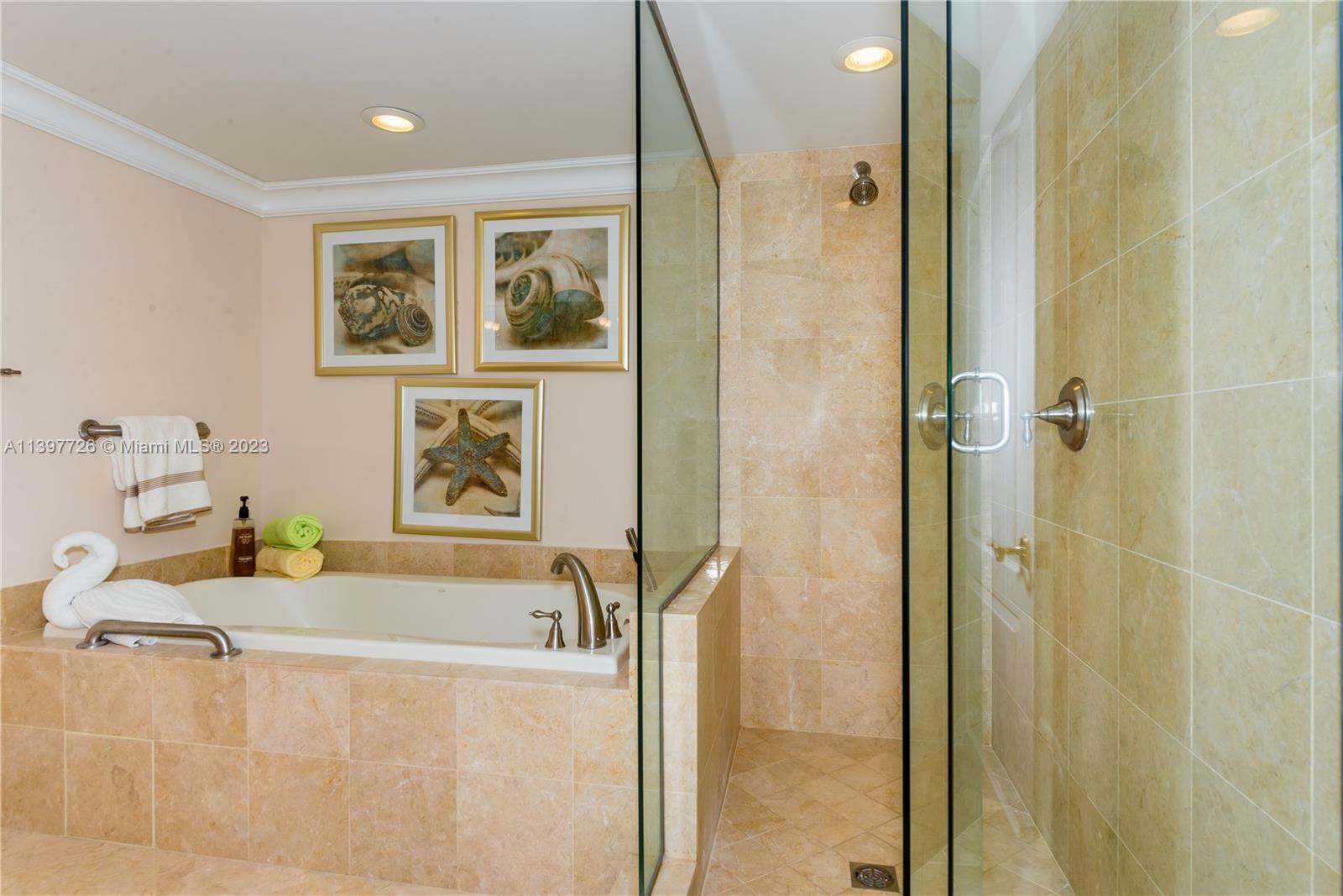 200 East Palmetto Park Road, Unit 700 Boca Raton, FL 33432 - Photo 17 of 31 a bathroom with a tub sink and mirror
