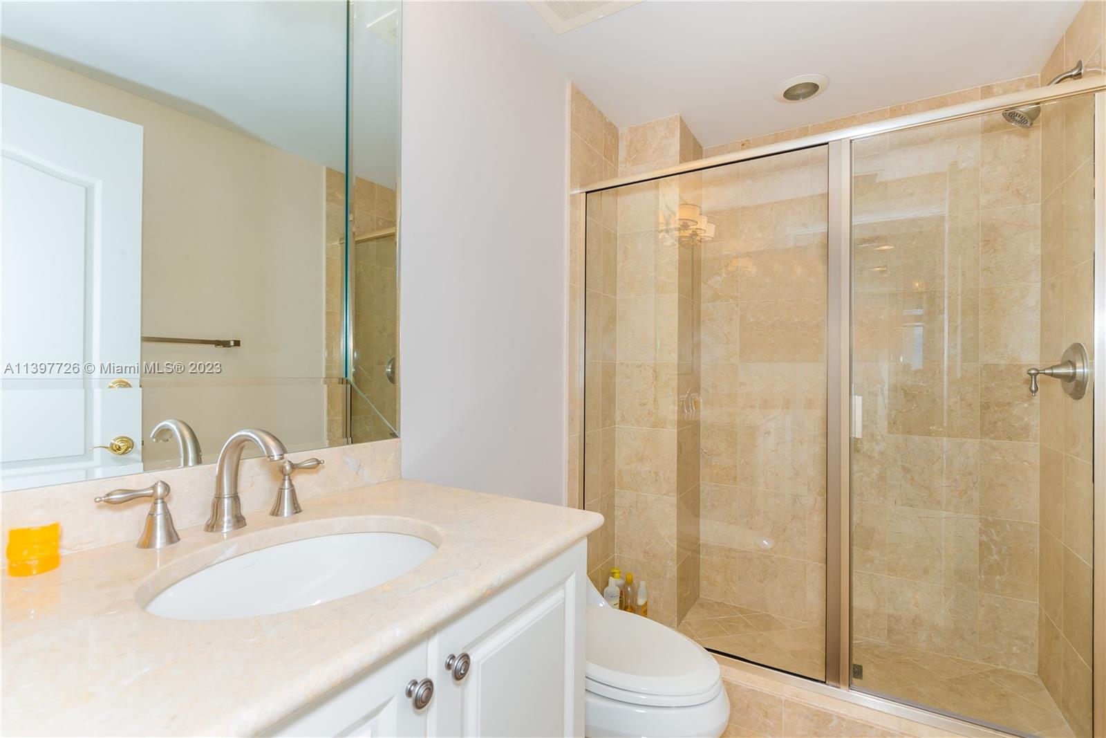 200 East Palmetto Park Road, Unit 700 Boca Raton, FL 33432 - Photo 24 of 31 a bathroom with a sink and a mirror