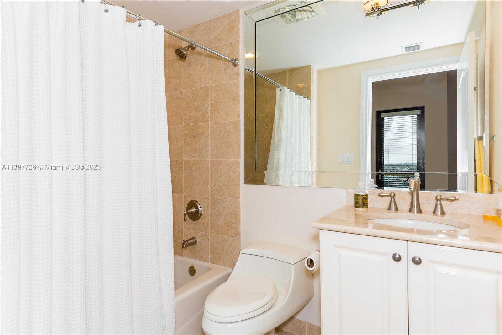 200 East Palmetto Park Road, Unit 700 Boca Raton, FL 33432 - Photo 27 of 31 a bathroom with a granite countertop sink toilet and shower