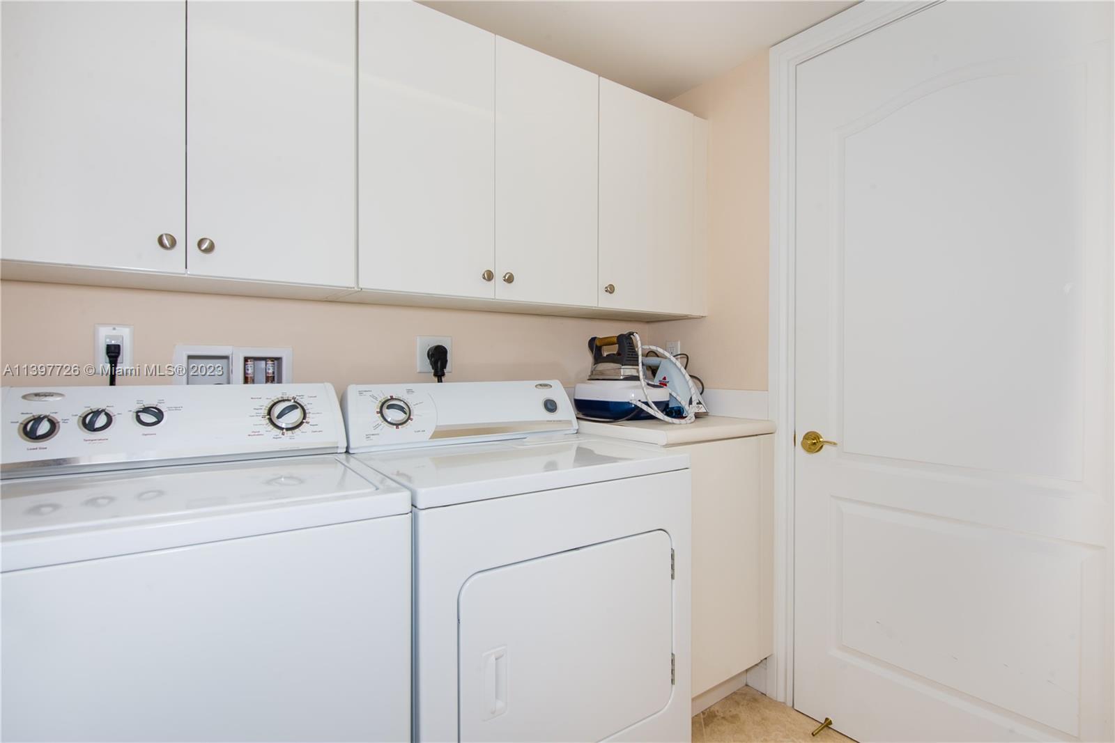 200 East Palmetto Park Road, Unit 700 Boca Raton, FL 33432 - Photo 29 of 31 a utility room with dryer and washer