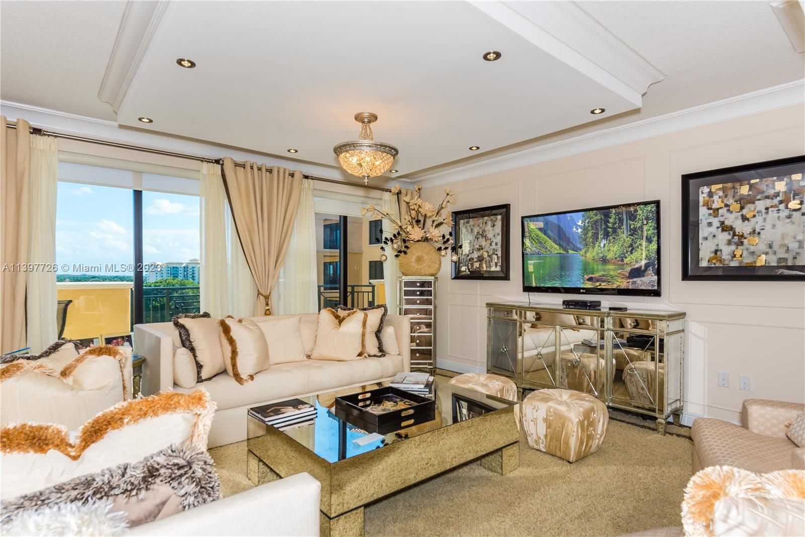 200 East Palmetto Park Road, Unit 700 Boca Raton, FL 33432 - Photo 5 of 31 a living room with furniture a flat screen tv and a large window