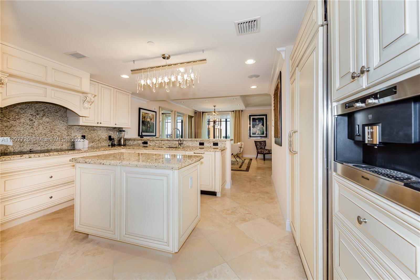 200 East Palmetto Park Road, Unit 700 Boca Raton, FL 33432 - Photo 8 of 31 a large white kitchen with a large window