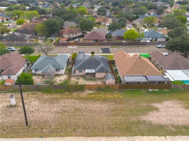 an aerial view of a house with a ocean view