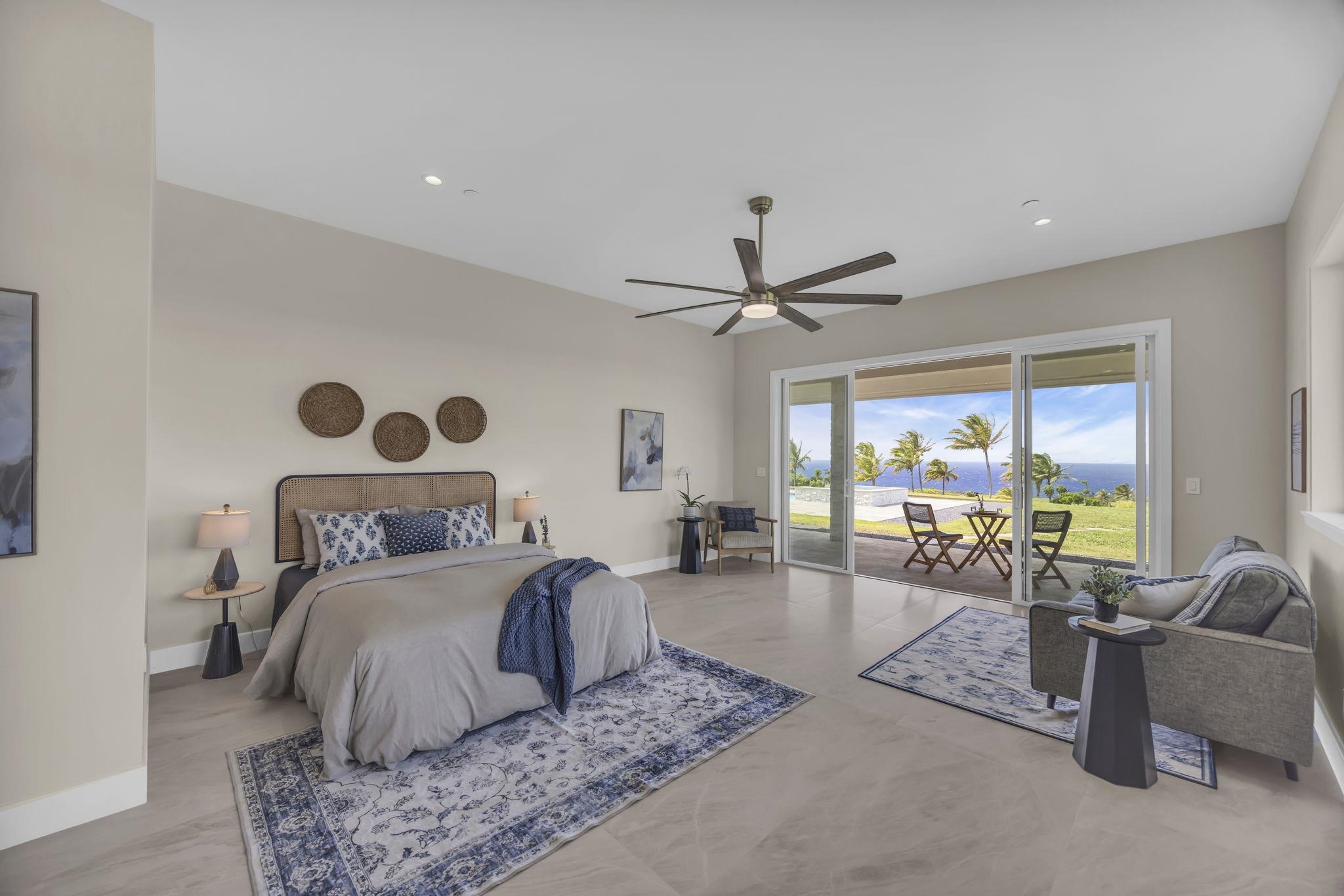 a bedroom with a large bed and a large window