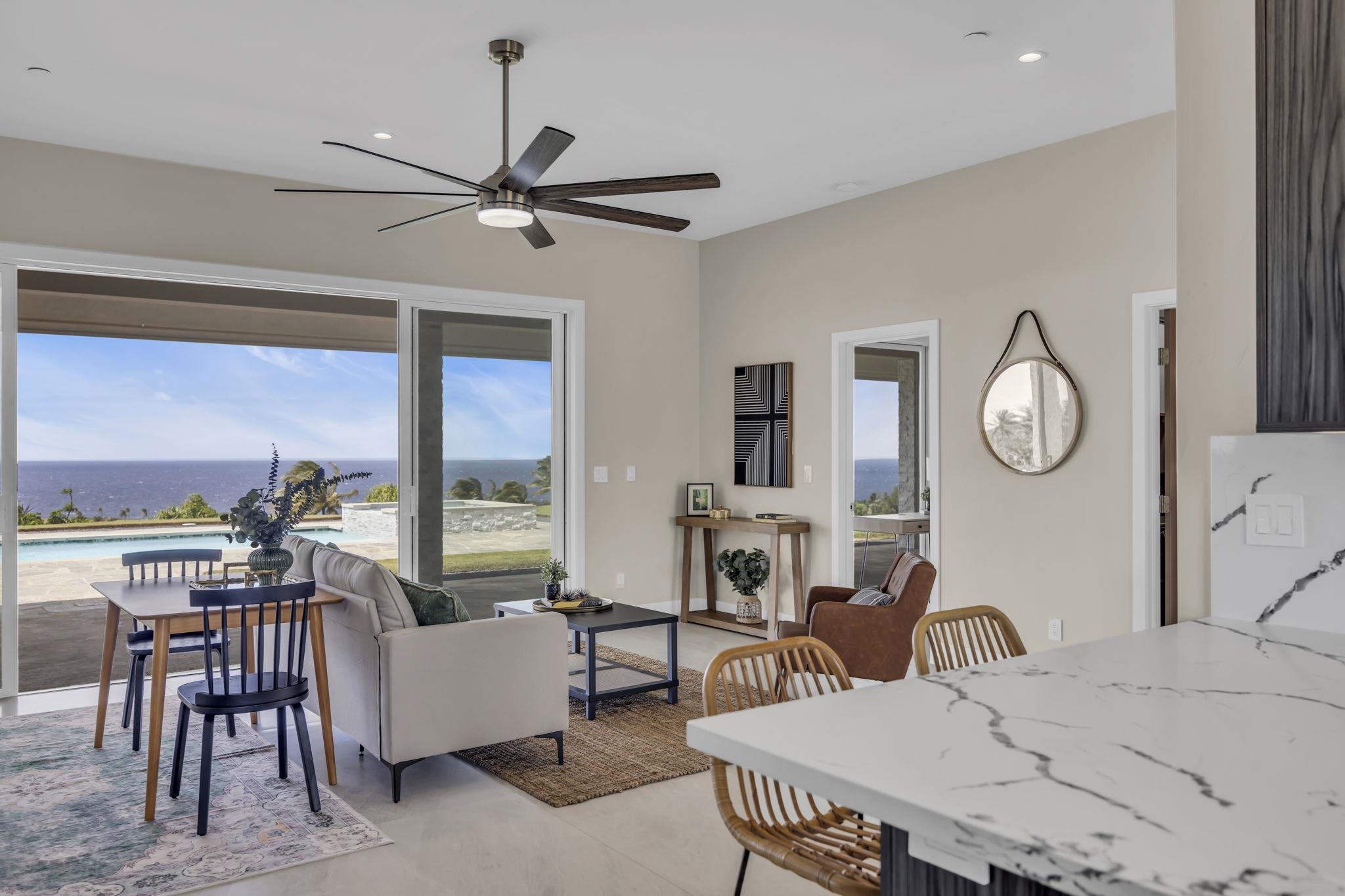 500 Kai Huki Circle, Unit B Haiku, HI 96708 - Photo 17 of 50 a living room with furniture a large window and a chandelier