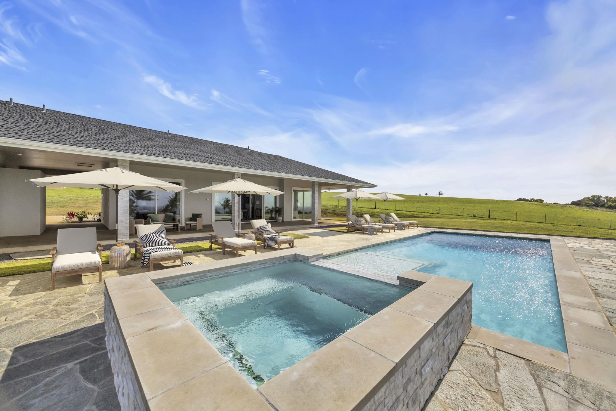 500 Kai Huki Circle, Unit B Haiku, HI 96708 - Photo 2 of 50 a view of a swimming pool with lounge chair