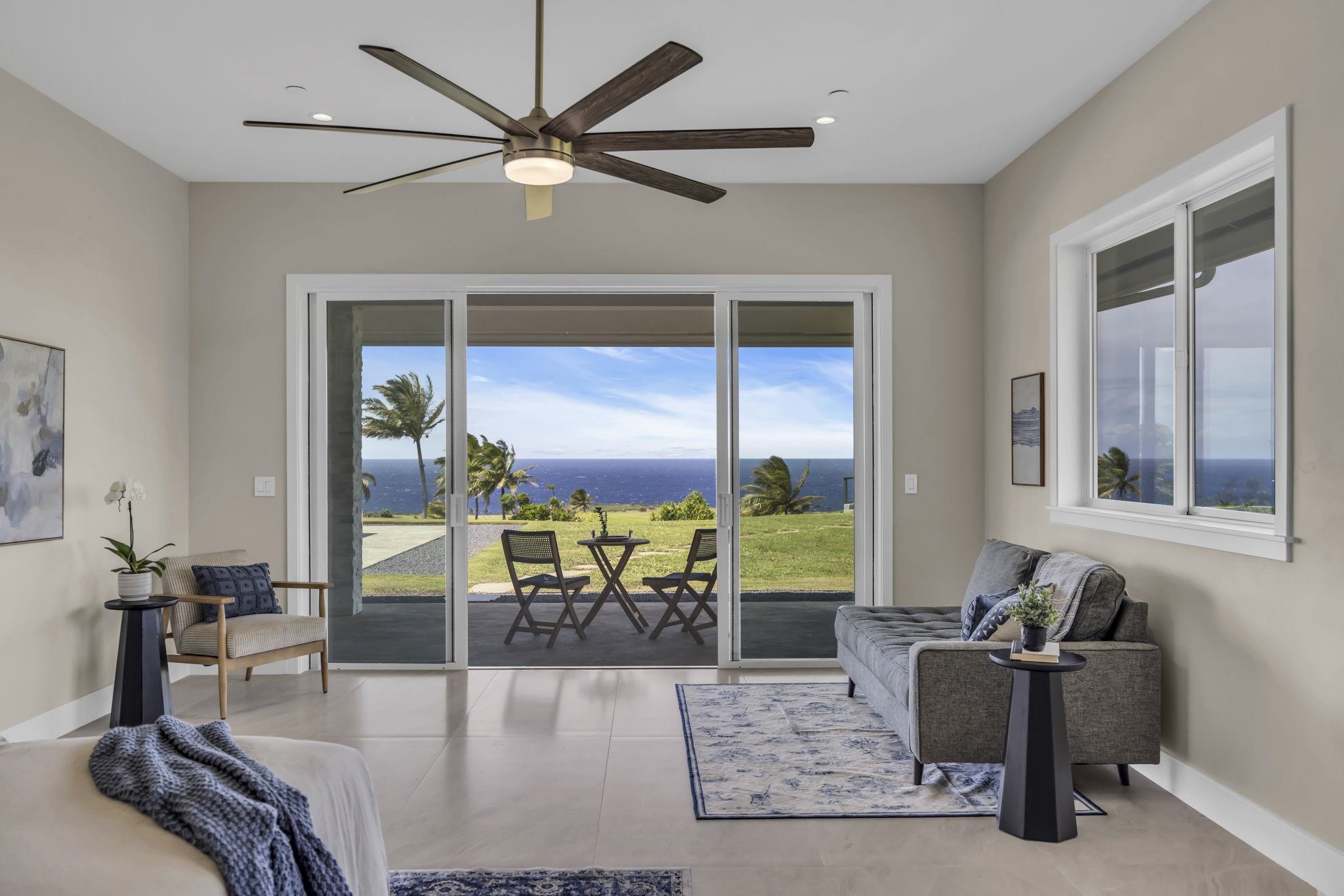 500 Kai Huki Circle, Unit B Haiku, HI 96708 - Photo 29 of 50 a living room with fireplace furniture and a large window