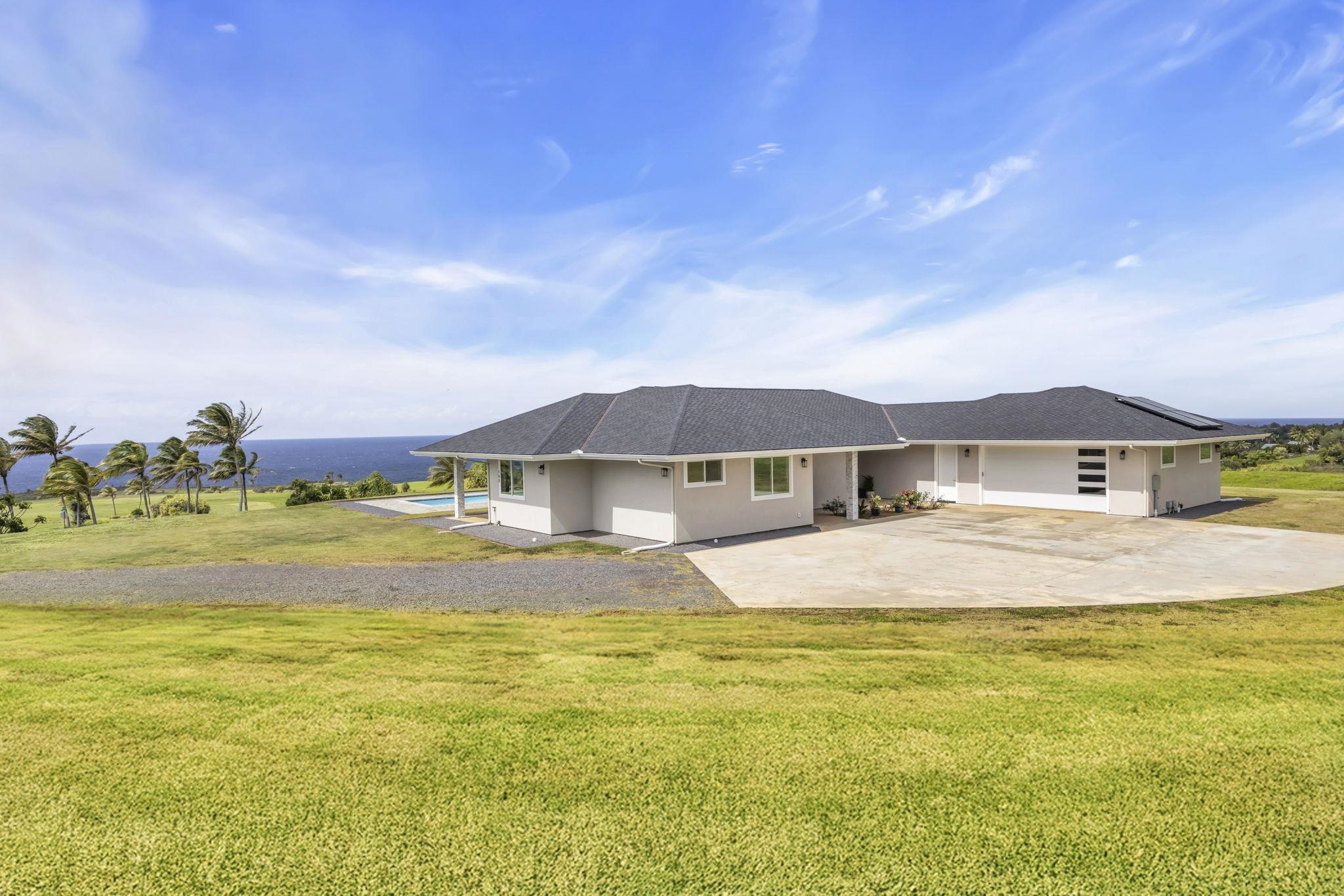 500 Kai Huki Circle, Unit B Haiku, HI 96708 - Photo 33 of 50 a front view of house with yard and swimming pool