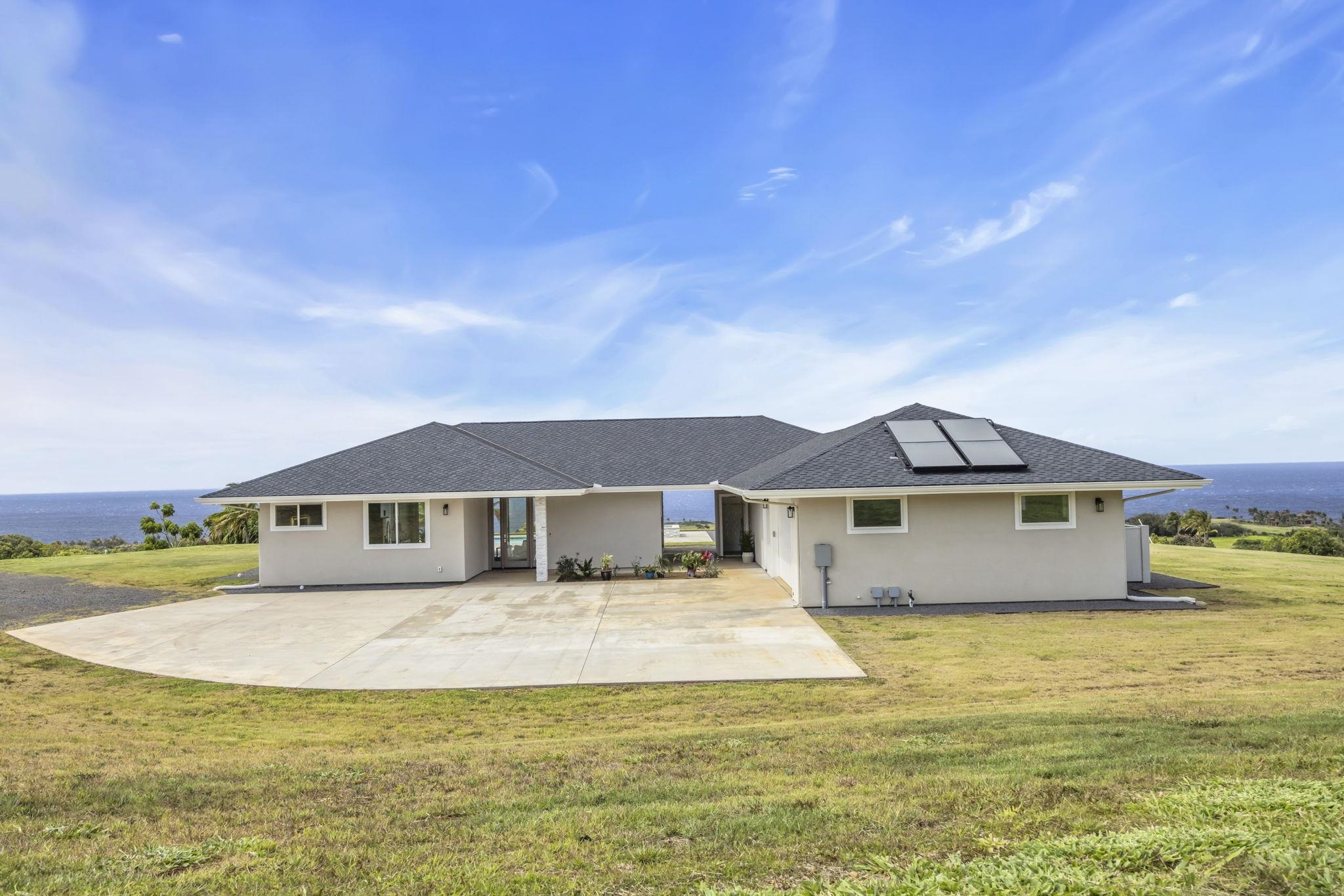 500 Kai Huki Circle, Unit B Haiku, HI 96708 - Photo 34 of 50 a front view of a house with a yard