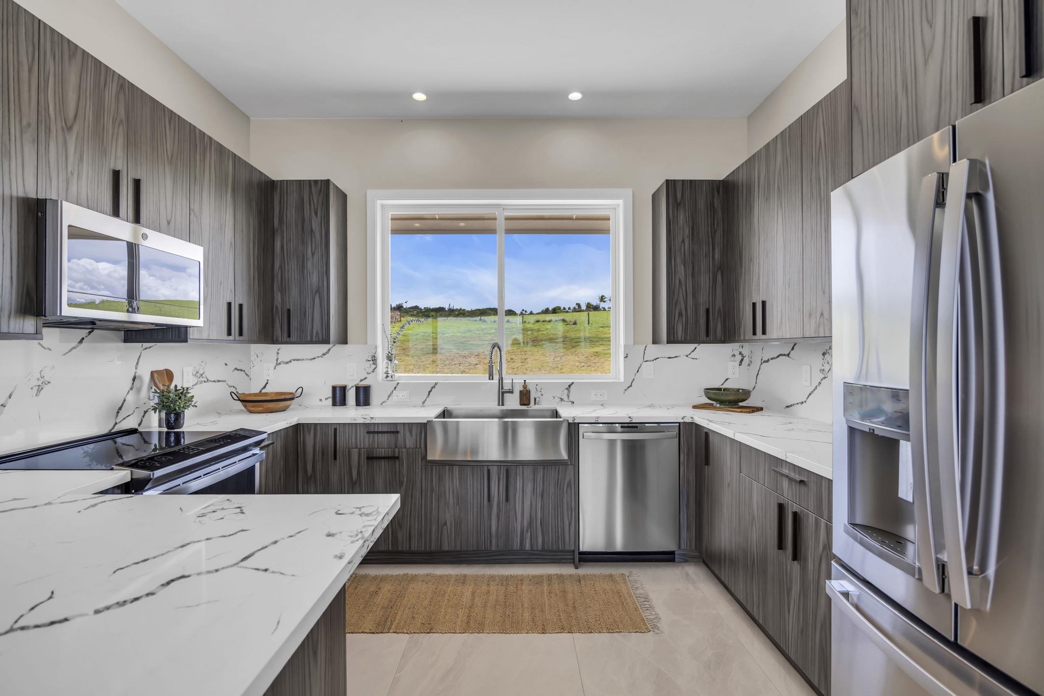 500 Kai Huki Circle, Unit B Haiku, HI 96708 - Photo 9 of 50 a kitchen with a sink stove top oven and refrigerator