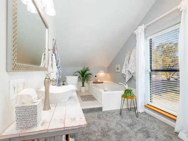 a living room filled with furniture and a table
