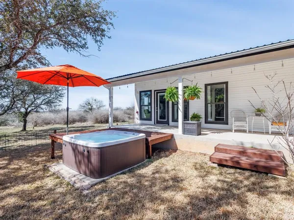 a swimming pool with outdoor seating