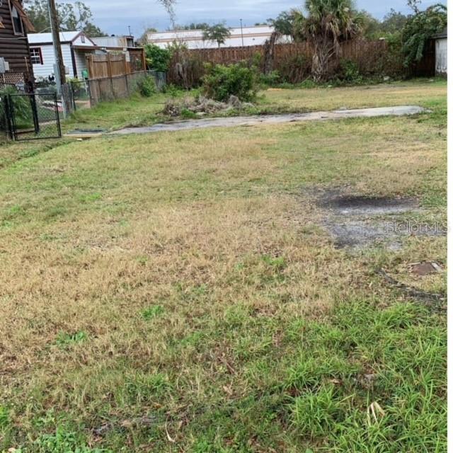 a view of a field with an trees