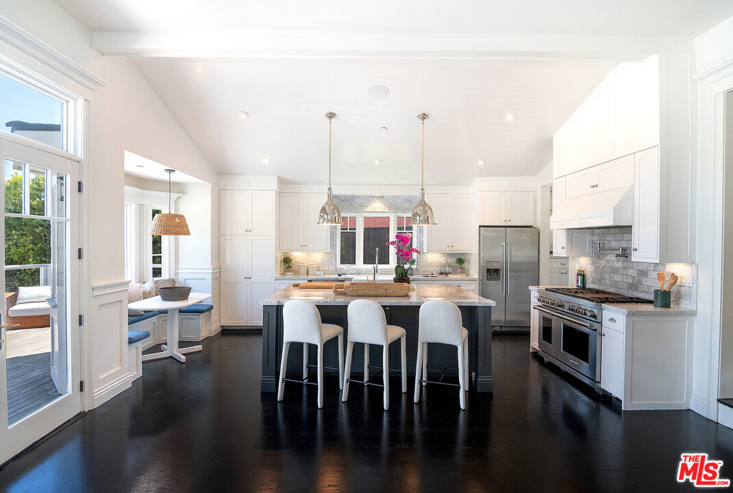 2737 Angus Street Los Angeles, CA 90039 - Photo 18 of 56 a large kitchen with a table and chairs