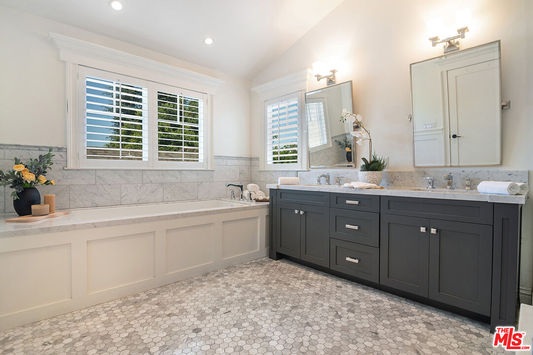 2737 Angus Street Los Angeles, CA 90039 - Photo 26 of 56 a spacious bathroom with a tub sink and mirror