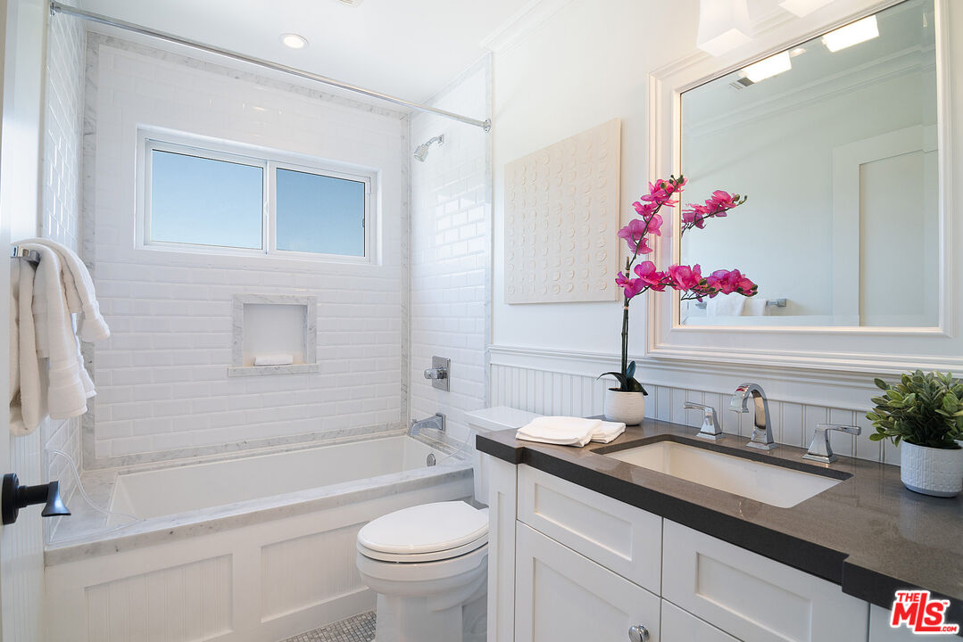2737 Angus Street Los Angeles, CA 90039 - Photo 31 of 56 a bathroom with a granite countertop sink mirror toilet and bathtub