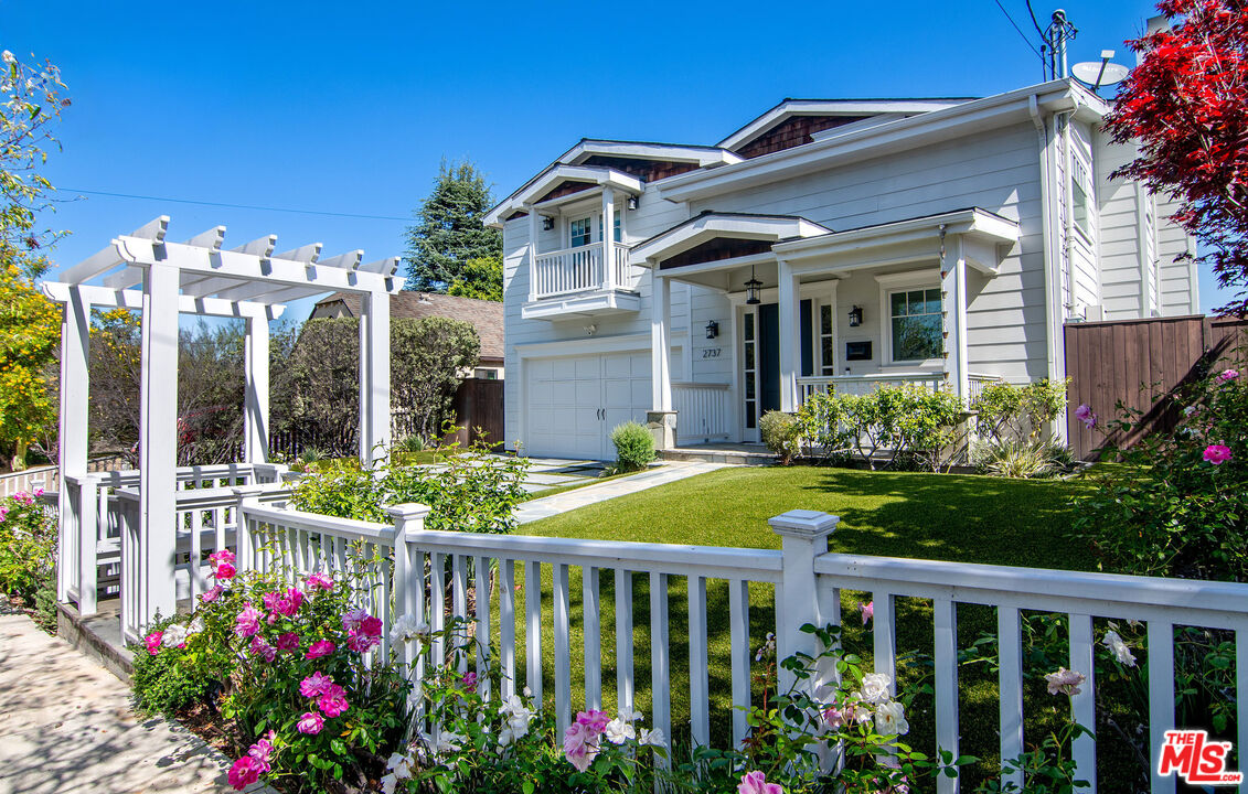 2737 Angus Street Los Angeles, CA 90039 - Photo 52 of 56 a view of a house with fountain and a flower garden
