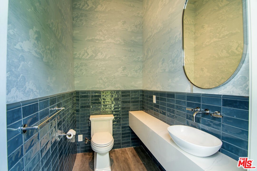 2737 Angus Street Los Angeles, CA 90039 - Photo 54 of 56 a bathroom with a toilet a sink and mirror