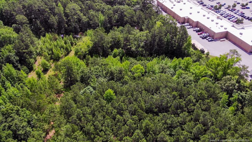 24-87 Nc Cameron, NC 28326 - Photo 4 of 28 an aerial view of residential house with outdoor space and trees all around