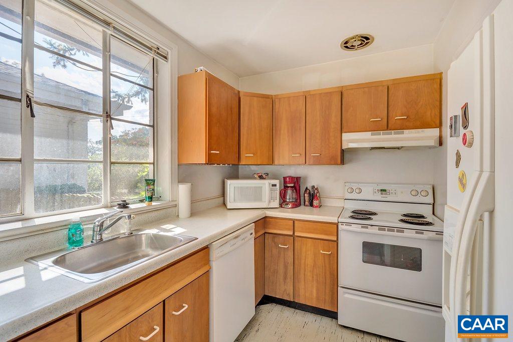 1628 St Annes Road Charlottesville, VA 22901 - Photo 12 of 20 a kitchen with a sink stove top oven and cabinets