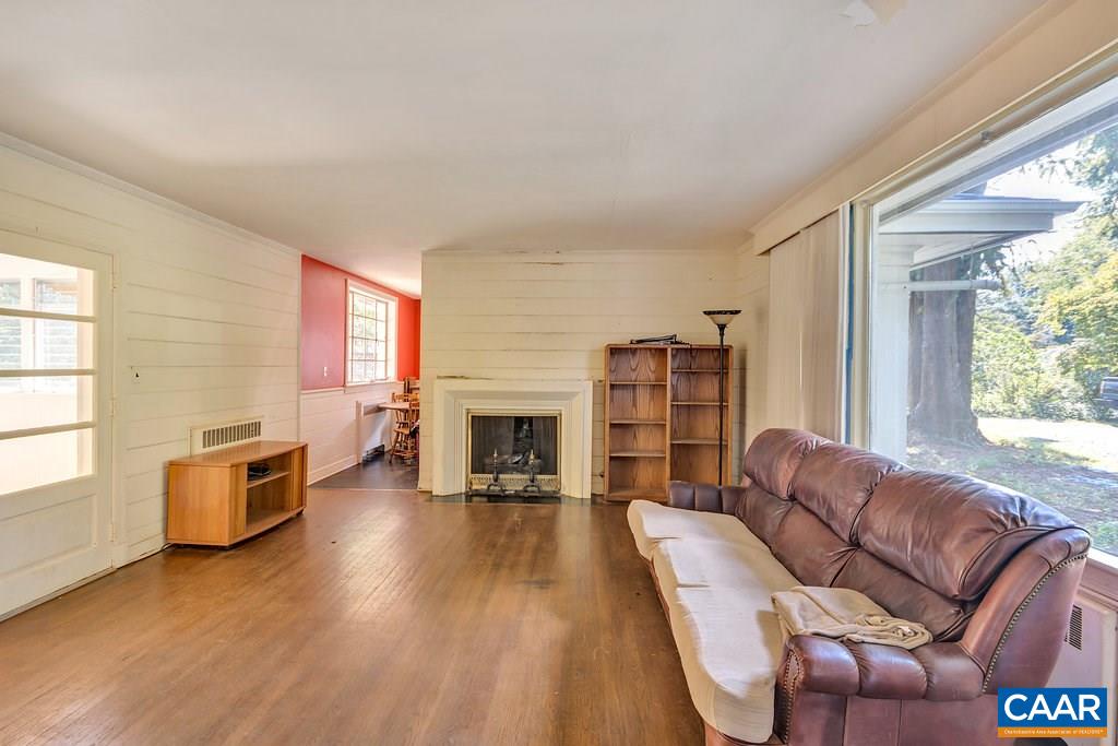 1628 St Annes Road Charlottesville, VA 22901 - Photo 5 of 20 a living room with furniture fireplace and flat screen tv