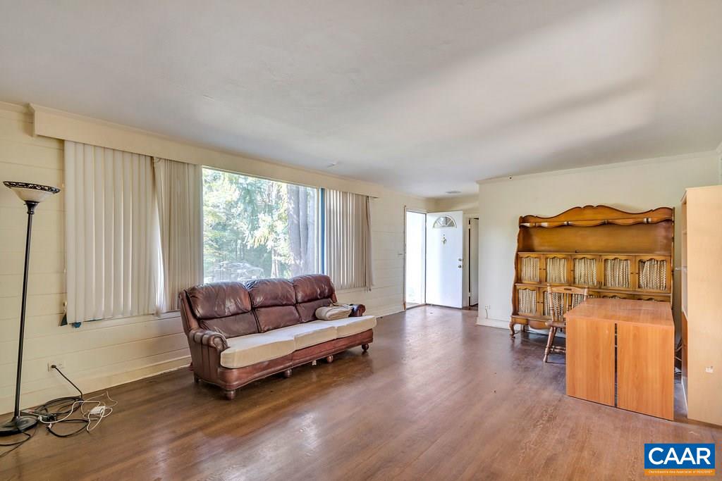 1628 St Annes Road Charlottesville, VA 22901 - Photo 6 of 20 a living room with furniture and a wooden floor